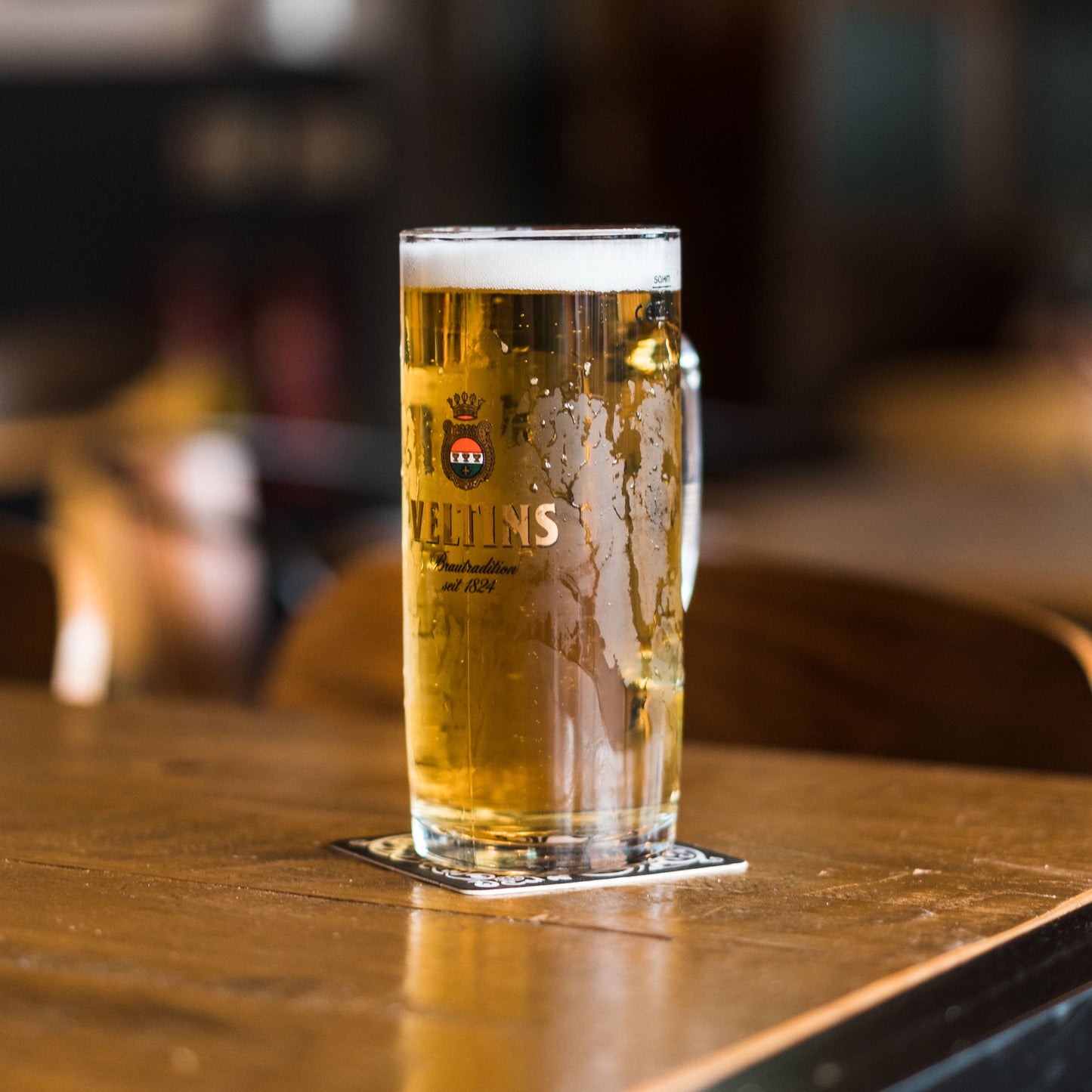Full Veltins Glass On Table