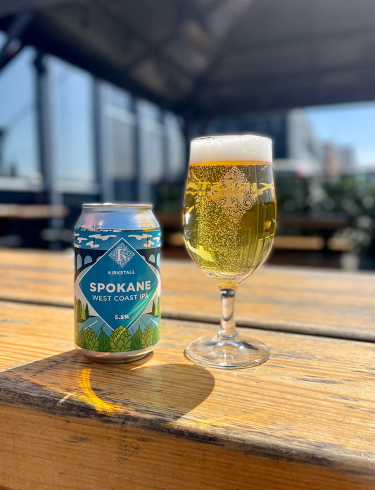 Spokane 330ml Can And Half Pint On Table Outside